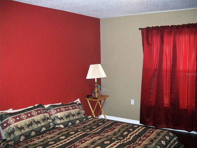 bedroom featuring a textured ceiling