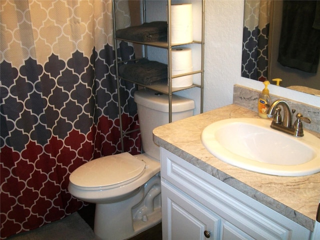 bathroom with vanity and toilet