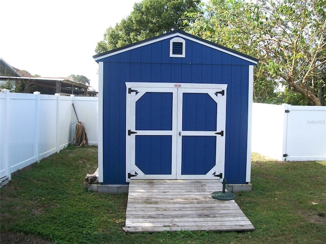 view of outdoor structure featuring a lawn