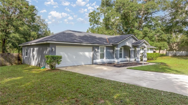 ranch-style home featuring a front yard and a garage