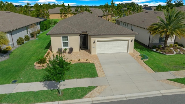 view of front of house featuring a front yard and a garage