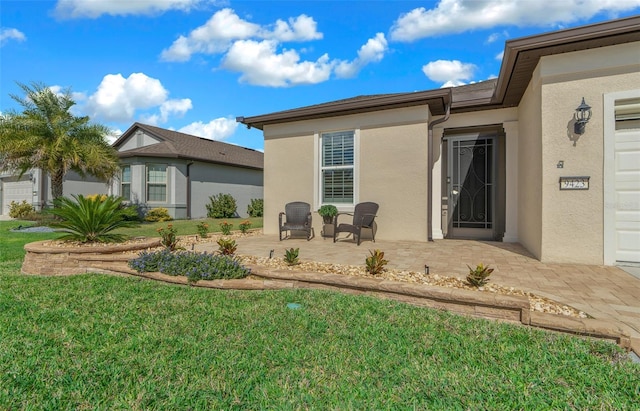 exterior space with a patio area and a yard