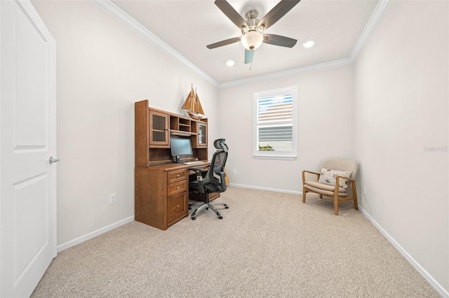 carpeted home office featuring ceiling fan and crown molding