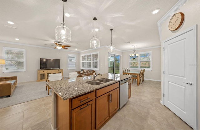 kitchen featuring sink, an island with sink, dishwasher, pendant lighting, and crown molding