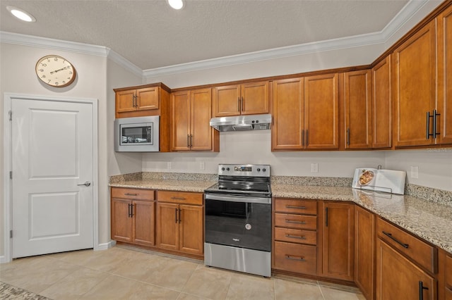 kitchen with ornamental molding, light stone countertops, light tile patterned floors, appliances with stainless steel finishes, and a textured ceiling