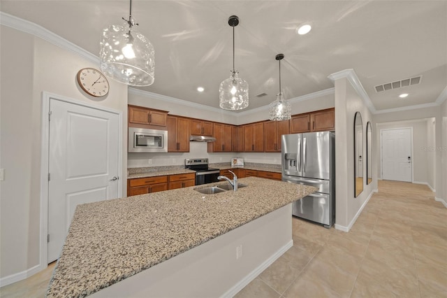 kitchen featuring sink, a kitchen island with sink, decorative light fixtures, and stainless steel appliances