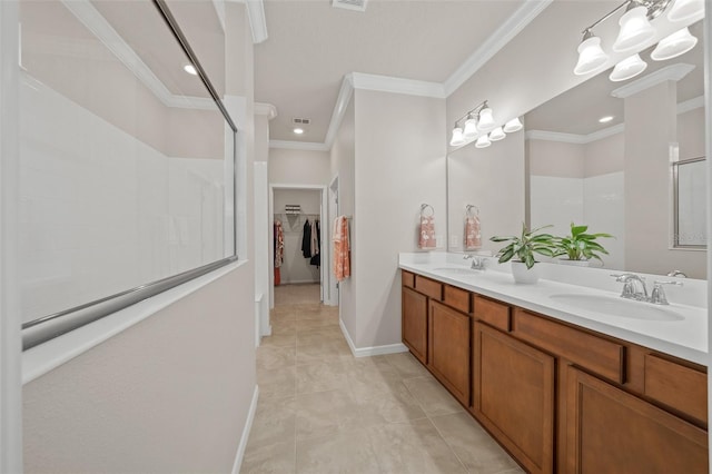 bathroom featuring vanity, crown molding, tile patterned floors, and walk in shower