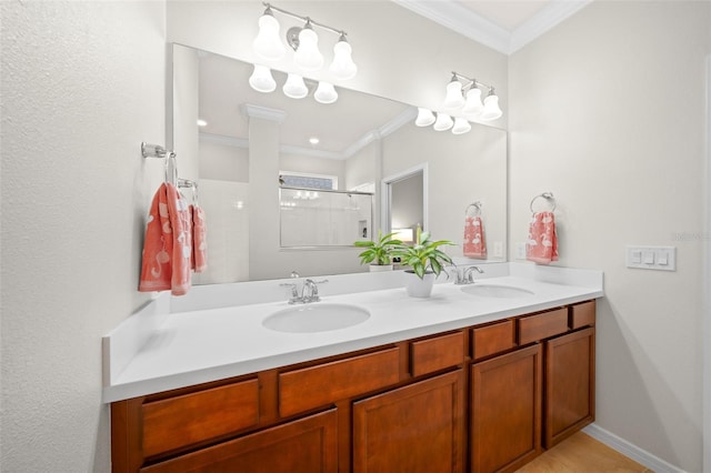 bathroom featuring vanity, a shower with shower door, and ornamental molding