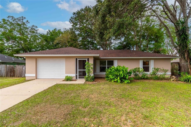 ranch-style house featuring a garage and a front lawn