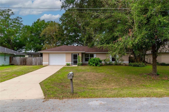 single story home featuring a front yard and a garage