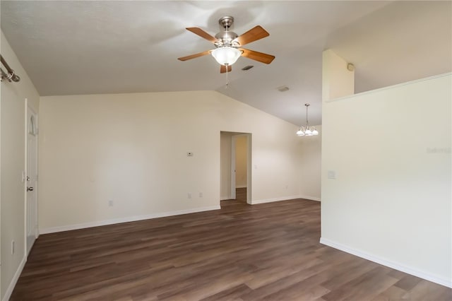 unfurnished room with ceiling fan with notable chandelier, vaulted ceiling, and dark hardwood / wood-style floors