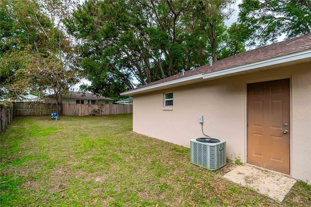 view of yard with central AC unit