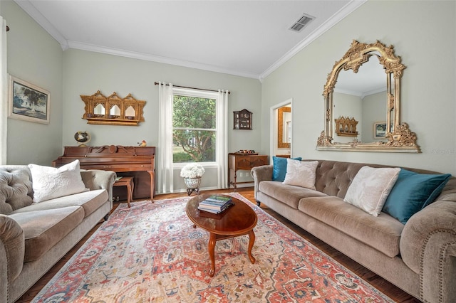 living room with ornamental molding and hardwood / wood-style floors