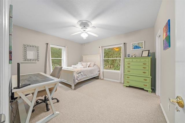 carpeted bedroom with ceiling fan