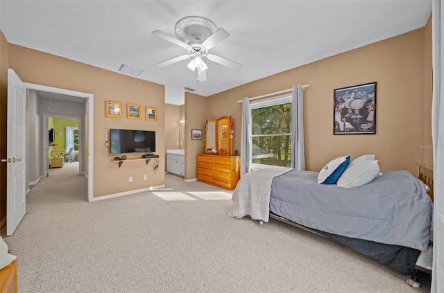 bedroom featuring light carpet and ceiling fan