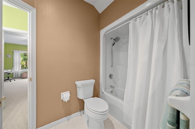 bathroom featuring toilet, lofted ceiling, shower / bath combination with curtain, and tile patterned flooring