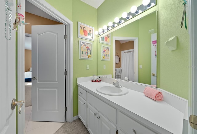 bathroom featuring vanity and tile patterned flooring