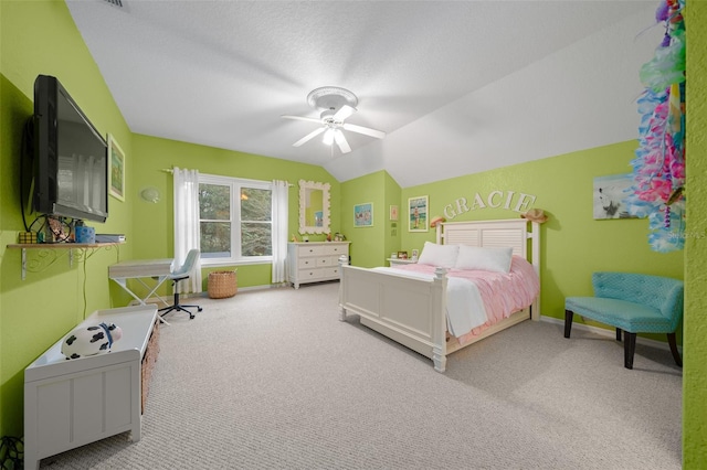 carpeted bedroom featuring vaulted ceiling, a textured ceiling, and ceiling fan