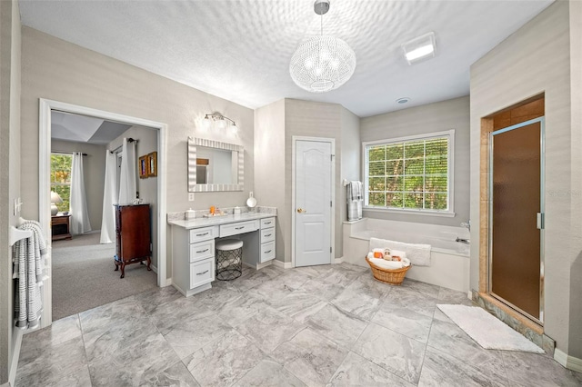 bathroom featuring vanity, plus walk in shower, a textured ceiling, and an inviting chandelier