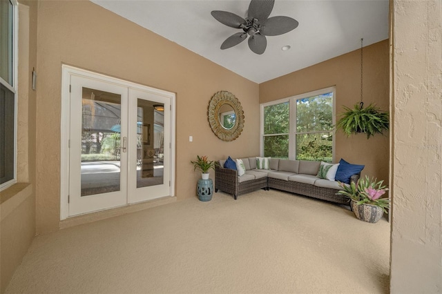 interior space featuring french doors, carpet flooring, and ceiling fan