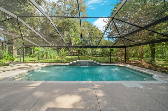 view of pool featuring pool water feature, a patio, and glass enclosure