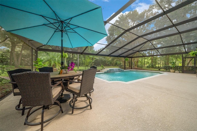 view of swimming pool featuring pool water feature, a patio area, and glass enclosure