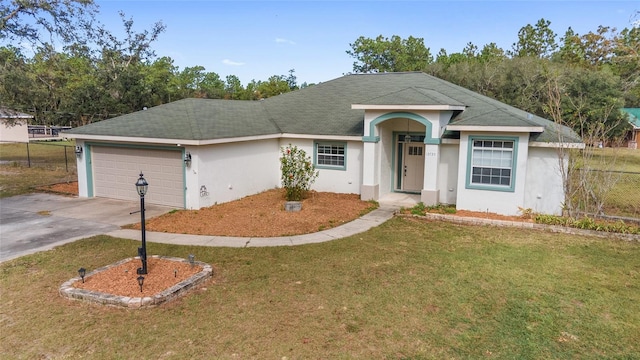 single story home with a front yard and a garage