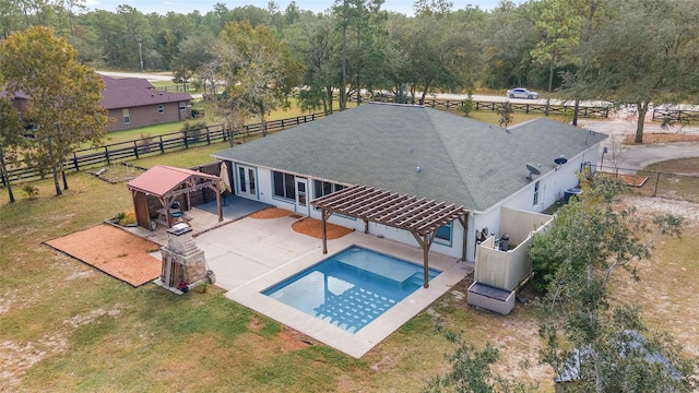 view of pool with a patio, a lawn, and a jacuzzi