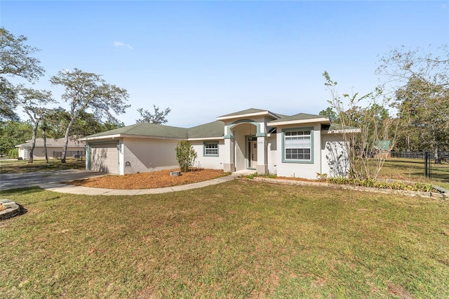 view of front of house with a front lawn and a garage