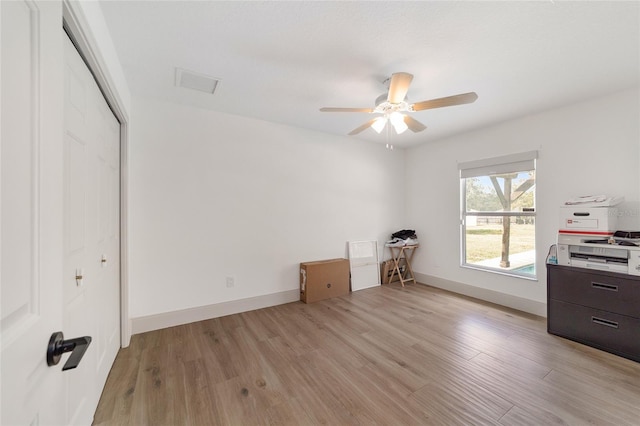 bedroom featuring light hardwood / wood-style floors, a closet, and ceiling fan