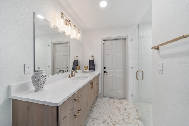 bathroom with vanity and an enclosed shower