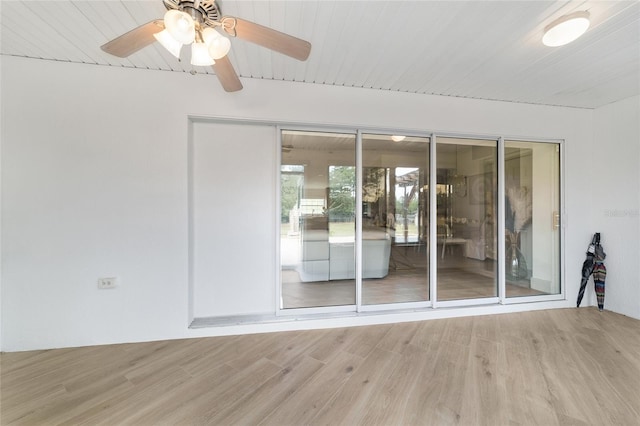 spare room featuring ceiling fan, wood-type flooring, and wood ceiling