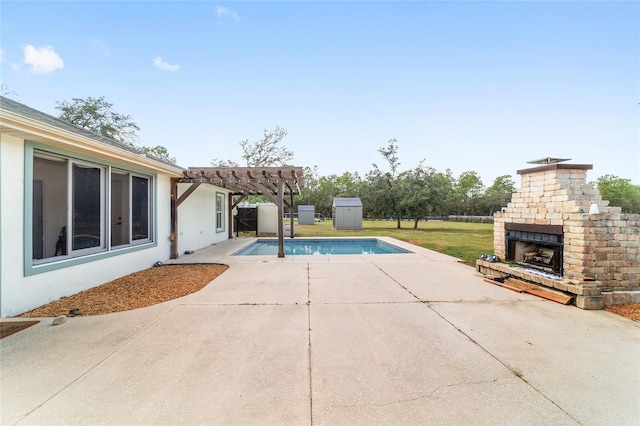 view of pool featuring an outdoor brick fireplace, a patio area, and a pergola