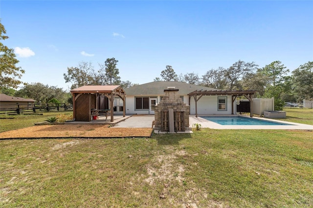 rear view of house featuring a gazebo, a patio area, a lawn, and a pergola