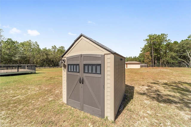 view of outbuilding with a lawn