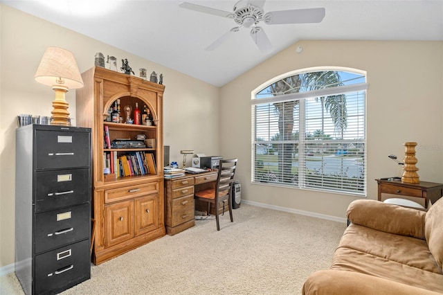 home office featuring ceiling fan, lofted ceiling, and light colored carpet