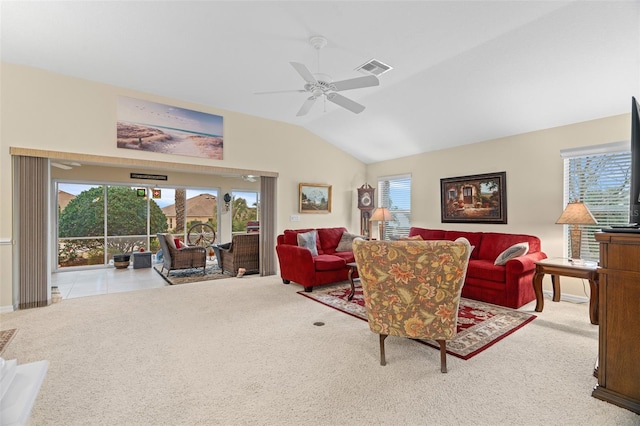 living room featuring light carpet, lofted ceiling, and ceiling fan