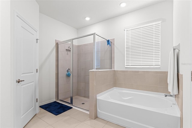 bathroom featuring tile patterned floors and plus walk in shower