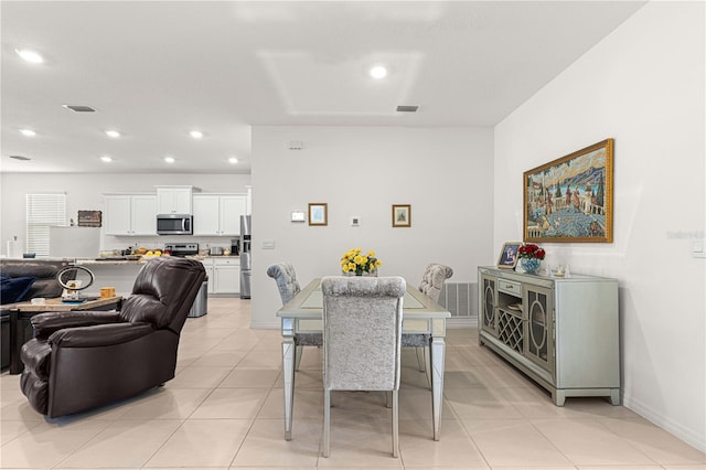 dining area with light tile patterned floors