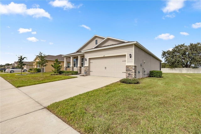 view of front of property with a front yard and a garage