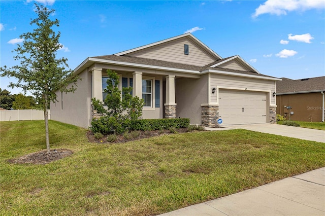 view of front facade featuring a front lawn and a garage