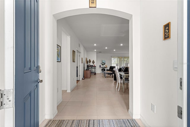 hallway featuring light tile patterned floors