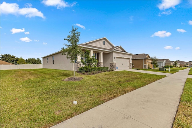 view of front of home with a garage and a front lawn