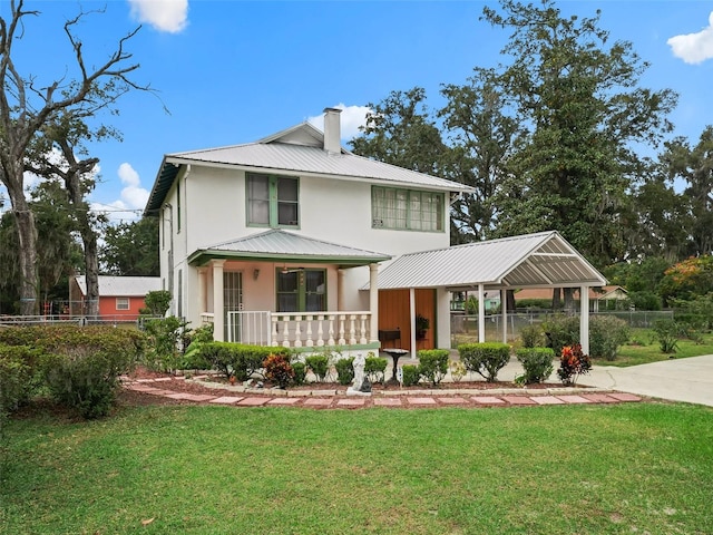 view of front of property with a porch and a front yard