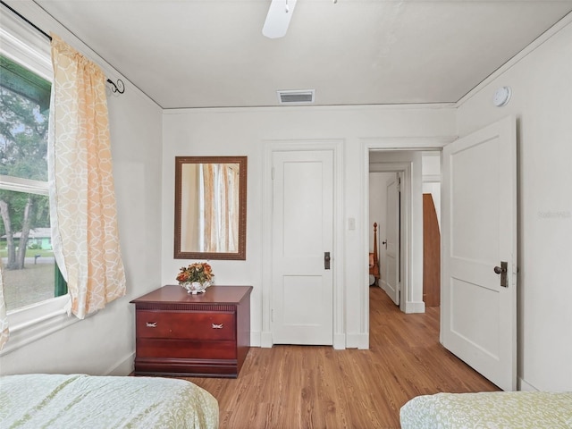 bedroom featuring ceiling fan and light wood-type flooring