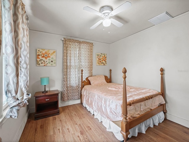 bedroom featuring light hardwood / wood-style floors and ceiling fan