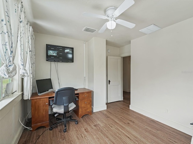 office area featuring light hardwood / wood-style floors and ceiling fan