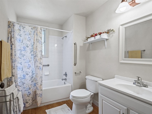 full bathroom with vanity, toilet, hardwood / wood-style flooring, and shower / tub combo