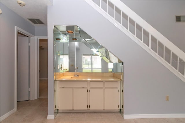 kitchen with sink and light tile patterned floors