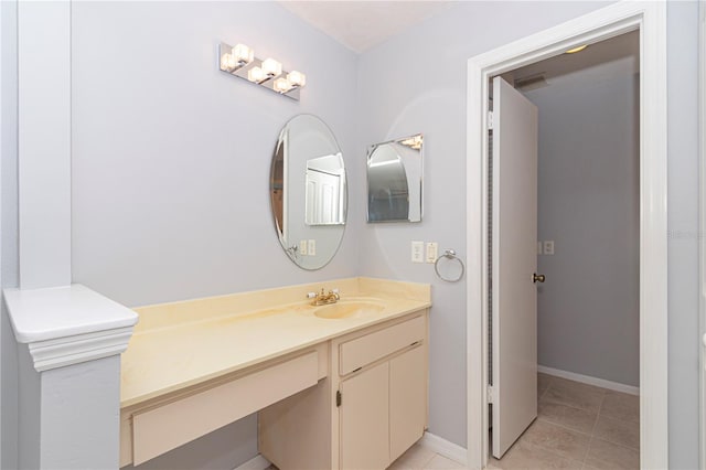 bathroom with vanity and tile patterned floors